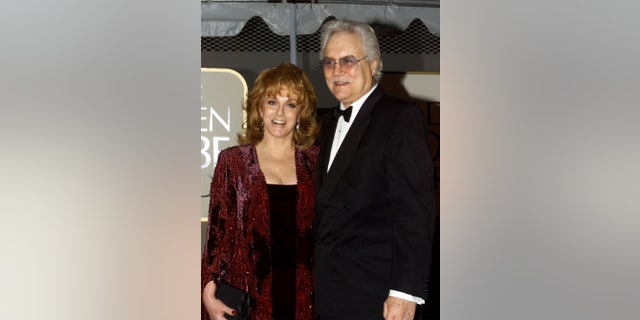 Actress Ann Margaret and her husband Roger Smith arrive at the 56th annual Golden Globe Awards ceremony in Beverly Hills, January 24, 1999.