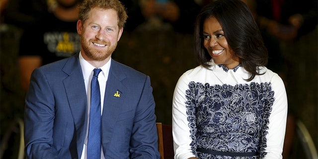Britain's Prince Harry and first lady Michelle Obama watch a basketball game played by wounded warriors at Fort Belvoir, Virginia October 28, 2015. Prince Harry is at Fort Belvoir to meet soldiers and spread the word about the Invictus Games, which supports wounded warriors. Prince Harry spearheaded the Invictus Games, which was first held in London last September.