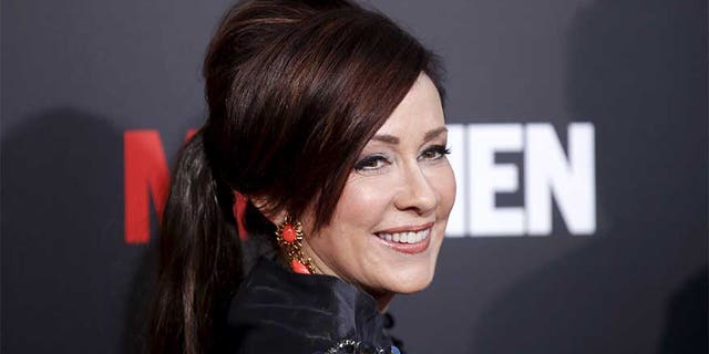 Actress Patricia Heaton poses at the "Mad Men" Black and Red Ball to celebrate the final seven episodes of the AMC television series in Los Angeles Wednesday, March 25, 2015. REUTERS/Danny Moloshok - RTR4UWFR