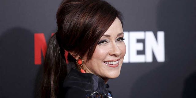 Actress Patricia Heaton poses at the "Mad Men" Black and Red Ball to celebrate the final seven episodes of the AMC television series in Los Angeles Wednesday, March 25, 2015. REUTERS/Danny Moloshok - RTR4UWFR