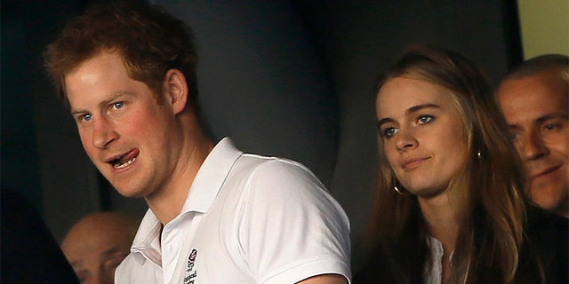 Prince Harry attends WE Day approximately in 2013 with Cressida Bonas, British model and actress of the time.