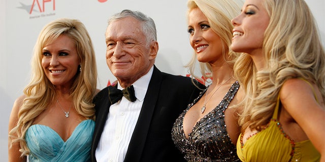 Hugh Hefner (2nd L) poses with Bridget Marquardt (L), Holly Madison and Kendra Wilkinson (R).