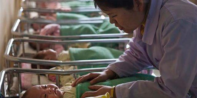 A baby boy born to a Chinese woman did not contract the rabies that killed his mother shortly after his birth.
