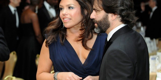TV food personality Rachael Ray and her husband John Cusimano attend the White House Correspondents' Association Dinner in Washington, May 1, 2010.