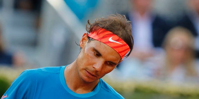 Rafael Nadal of Spain reacts during the men's singles final match against Andy Murray of Britain at the Madrid Open Tennis tournament in Madrid, Spain, Sunday, May 10, 2015. (AP Photo/Paul White)