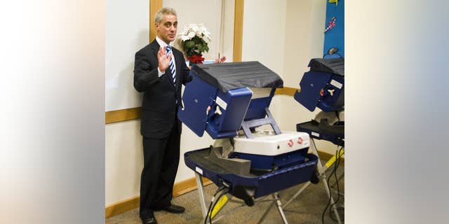 Chicago mayoral candidate Rahm Emanuel casts his ballot Monday, Jan. 31, 2011, at a Chicago public library on the first day of early voting for the Feb. 22, 2011 mayoral election. (AP Photo/Chicago Sun-Times, Rich Hein)
