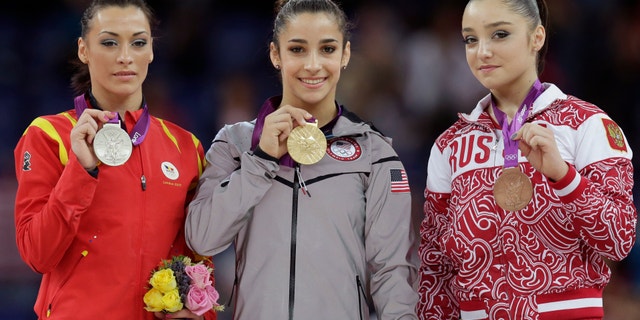 Aug. 7, 2012: U.S. gold medallist gymnast Alexandra Raisman, center, Romania's silver medallist Catalina Ponor, left, and bronze medallist Russia's Aliya Mustafina display their medals during the podium ceremony for the artistic gymnastics women's floor exercise final at the 2012 Summer Olympics.