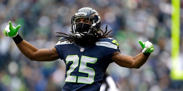 Richard Sherman reacts to a play against the St. Louis Rams in the first half of an NFL football game, Sunday, Dec. 30, 2012, in Seattle. (AP Photo/Elaine Thompson)