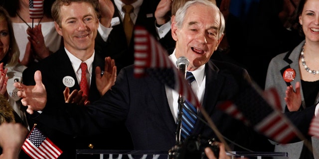 FILE: Jan. 3, 2012: Former GOP presidential candidate Texas Rep. Ron Paul and son Kentucky GOP Sen. Rand Paul at a rally in Ankeny, Iowa.