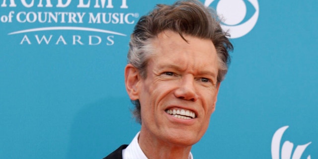 Singer Randy Travis arrives at the 45th annual Academy of Country Music Awards in Las Vegas.