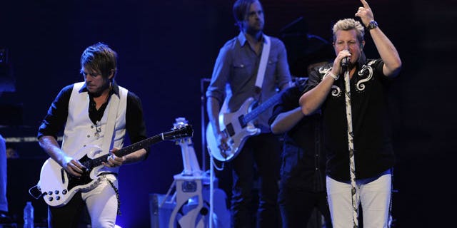 September 24: Gary LeVox, right, and Joe Don Rooney, left, of the band Rascal Flatts perform during the iHeartRadio music festival in Las Vegas.