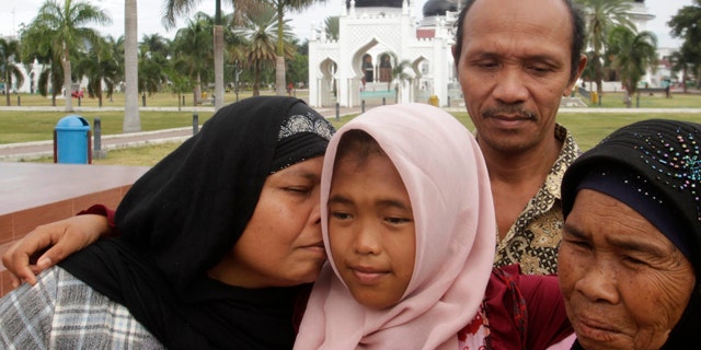 Raudhatul Jannah, was lost after being swept into the sea during the 2004 Indian Ocean tsunami. She was been found alive and living with a foster mother. She was reunited with her biological parents this week. (REUTERS/Junaidi Hanafiah)