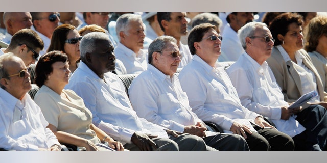 HAVANA, CUBA - MARCH 28: Cuban President Raul Castro (C) listens as Pope Benedict XVI conducts a mass at Havana's Revolution Square on the last day of his three day visit on March 28, 2012 in Havana, Cuba. Fourteen years after Pope John Paul II visited Cuba, Pope Benedict is making his first trip to the communist country. (Photo by Joe Raedle/Getty Images)
