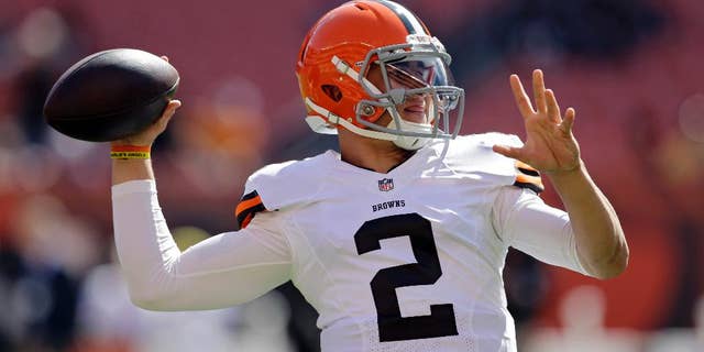 Cleveland Browns quarterback Johnny Manziel warms up before an NFL football game against the Baltimore Ravens, Sunday, Sept. 21, 2014, in Cleveland. (AP Photo/Tony Dejak)