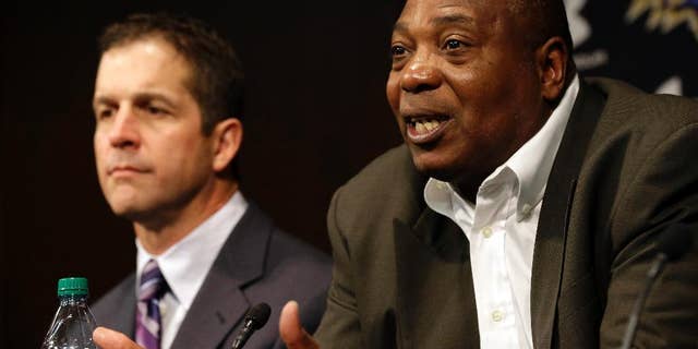 FILE - In this Feb. 7, 2013 file photo, Baltimore Ravens general manager and executive vice president Ozzie Newsome, right, speaks alongside head coach John Harbaugh during an NFL football news conference in Owings Mills, Md. Newsome will probably have plenty of tantalizing players to choose from when Baltimore is on the clock in the NFL draft. Yet it wouldn’t be the least bit surprising if he deals away the No. 17 pick. (AP Photo/Patrick Semansky, File)