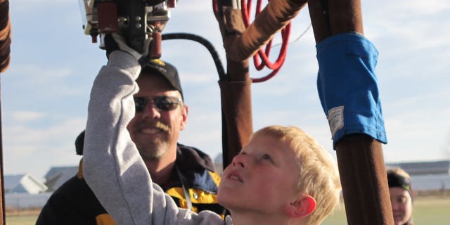 Nine-year-old Bobby Bradley is preparing for his first solo flight aboard an ultra-light balloon in June 2011.