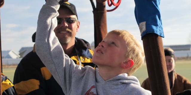 Nine-year-old Bobby Bradley is preparing for his first solo flight aboard an ultra-light balloon in June 2011.