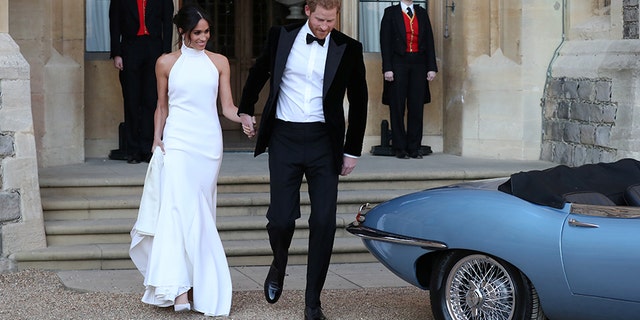 The newly married Duke and Duchess of Sussex, Meghan Markle and Prince Harry, leaving Windsor Castle after their wedding to attend an evening reception at Frogmore House, hosted by the Prince of Wales Windsor, Britain, May 19, 2018. Steve Parsons/Pool via REUTERS - RC16A6C13BD0