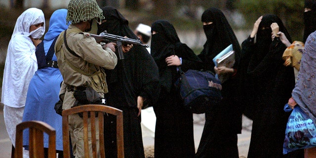 Baton-wielding female students took to the streets outside the Red Mosque in Islamabad, in July 2007.