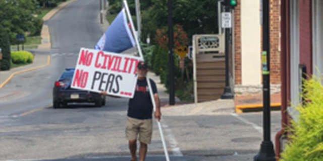 Protesters waited outside the restaurant Thursday.