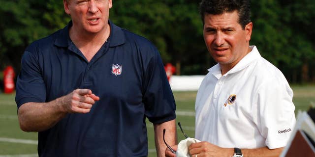 FILE - In this Aug. 4, 2010, file photo, NFL Commissioner Roger Goodell, left, talks with Washington Redskins owner Daniel Snyder, right, after the team's NFL football training camp at Redskins Park in Ashburn, Va. In a statement released Saturday, Sept. 13, 2014, Snyder says he supports Goodell, stating he "has always had the best interests of football at heart" and "we are fortunate to have him." (AP Photo/Rob Carr, File)