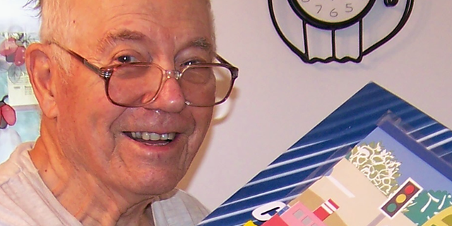 WWII veteran Reggie Peterson, 92, readies boxes for Operation Christmas Child.