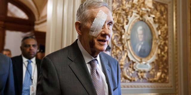 Senate Minority Leader Harry Reid of Nev. returns to Capitol Hill in Washington, Tuesday, Jan. 20, 2015, for the first time since suffering injuries after an exercise accident.