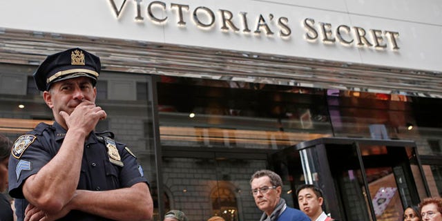Oct. 17, 2013: A New York City police officer stands in front of the Victoria's Secret Herald Square store in midtown Manhattan in New York.