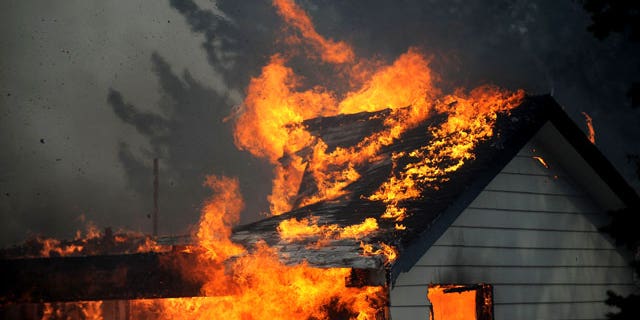 January 19, 2012: A house burns just south of the Old 395 Gas Station in Washoe Valley, Nev. Winds gusting up to 82 mph pushed a fast-moving brush fire south of Reno out of control on Thursday as it burned several homes, threatened dozens more and forced more than 4,000 people to evacuate their neighborhoods.