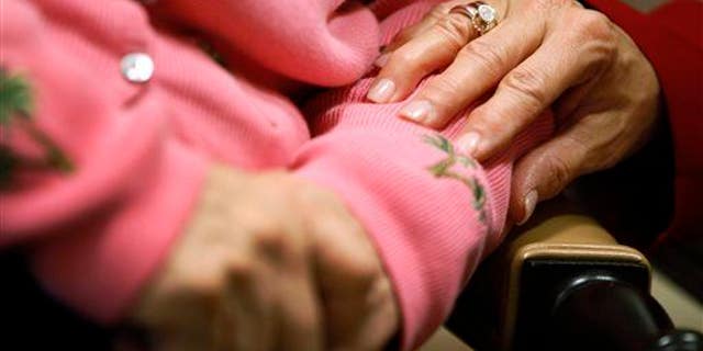 A person with Alzheimer's receives comfort from someone who cares. The states of New York, North Carolina, Washington, Minnesota, Wisconsin and New Hampshire are now offering online advice and tips to residents who are caring for a loved one or friend with dementia.