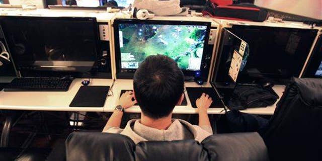 A college student plays online computer games at an Internet cafe in Seoul, South Korea.
