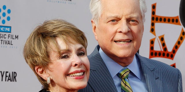 Actress Barbara Rush (L) arrives with TCM host Robert Osborne at the world premiere of the 40th anniversary restoration of the film "Cabaret" during the opening night gala of the 2012 TCM Classic Film Festival in Hollywood, California April 12, 2012.