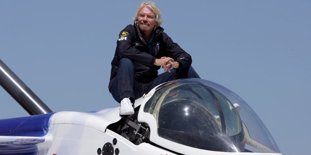 April 5: Billionaire adventurer Richard Branson poses aboard the Virgin Oceanic Expeditions deep sea submarine, in which Branson, Welsh and others plan to take solo piloted expeditions to the deepest point in each of the world's five oceans, at a news conference in Newport Beach, Calif.