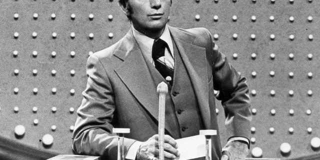 This June 1978 file photo shows Richard Dawson, host of "Family Feud" in character. Dawson, the wisecracking British entertainer who was among the schemers in the 1960s sitcom "Hogan's Heroes" and a decade later began kissing thousands of female contestants as host of the game show "Family Feud" died Saturday, June 2, 2012. He was 79.