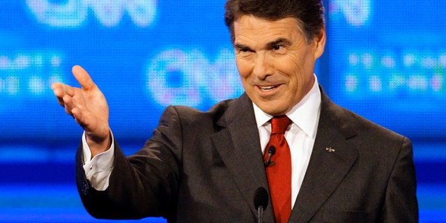 September 12: Republican presidential candidate Texas Gov. Rick Perry gestures during a Republican presidential debate in Tampa, Florida.