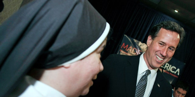 LINCOLN PARK, MI, - FEBRUARY 24:  Republican Presidential Candidate and former U.S. Sen. Rick Santorum (R-PA) (R) greets a catholic nun. (Photo by Bill Pugliano/Getty Images)