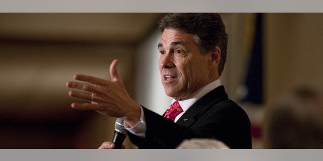 Texas Gov. Rick Perry speaks at the Williamson County Republican party's annual Reagan Dinner on Monday, Feb. 6 in Round Rock Texas. It was Perry's first public appearance in Texas since abandoning his run for the GOP presidential nomination. (AP Photo/Austin American-Statesman, Ricardo B. Brazziell)