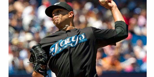 Toronto Blue Jays starting pitcher Ricky Romero throws against the New York Yankees during the first inning of a baseball game, Saturday, July 16, 2011, in Toronto. (AP Photo/The Canadian Press, Frank Gunn)