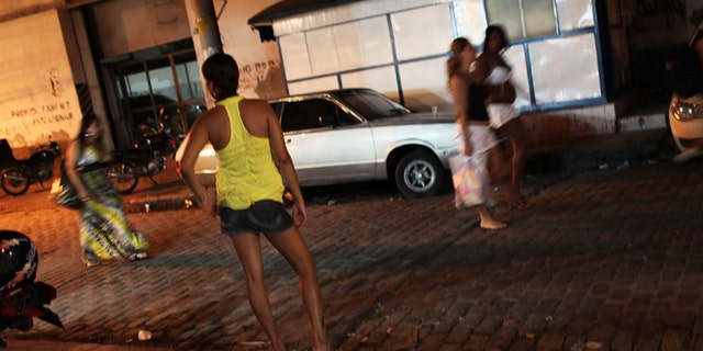 Female prostitutes walk the streets of the red light district, Vila Mimosa.   (Photo by Spencer Platt/Getty Images)