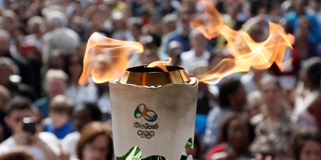 LEOPOLDINA, BRAZIL - MAY 16: Detail shot of Olympic Torch during day 14 of the Olympic Flame torch relay on May 16 , 2016 in Leopoldina, Brazil. The Olympic torch will pass through 329 cities from all states from the north to the south of Brazil, until arriving in Rio de Janeiro on August 5, to lit the cauldron.