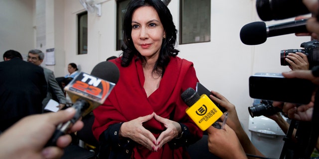In this Jan. 5, 2015 photo, Zury Rios Sosa, the daughter of Guatemala's former dictator Efrain Rios Montt, talks with reporters as she accompanies her father to court where he faces charges of genocide and crimes against humanity, in Guatemala City. Zury Rios Sosa, a three-time member of congress, announced Thursday, April 16, 2015 that she would accept the nomination of the Christian conservative Vision with Values party to run for president in general elections later this year. (AP Photo/Moises Castillo)