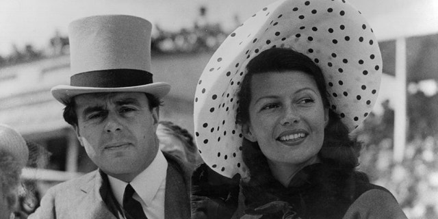 Prince Aly Khan (1911 - 1960) at Epsom races with his wife, Hollywood actress Rita Hayworth (1918 -1987).