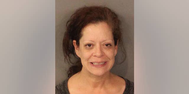 This undated photo released by the Placer County Sheriff's office shows Deirdre Orozco, 50, of Santa Clara, Calif. Orozco made her first court appearance Tuesday, Dec. 23, 2014, after a road rage incident was captured in a dramatic cellphone video that showed a vehicle forcing two motorists off a Northern California highway. She was charged with two counts of assault with a deadly weapon, two counts of false imprisonment, unlawful use of a badge, reckless driving and resisting arrest. (AP Photo/Placer County Sheriff's Office)