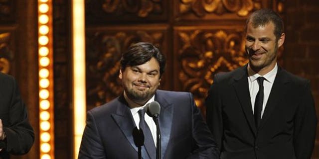 FILE - This June 12, 2011 file photo shows songwriter Robert Lopez, left, and Matt Stone accepting the award for Best Book of a Musical for "The Book of Mormon" during the 65th annual Tony Awards in New York. Lopez, who helped create "Avenue Q" and "The Book of Mormon," is up for an Academy Award next month along with his co-writing partner and wife, Kristen Anderson-Lopez, for best song for "Let it Go" from the animated film "Frozen." (AP Photo/Jeff Christensen, File)