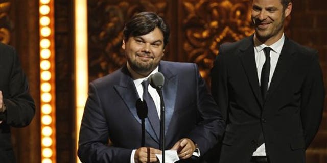 FILE - This June 12, 2011 file photo shows songwriter Robert Lopez, left, and Matt Stone accepting the award for Best Book of a Musical for "The Book of Mormon" during the 65th annual Tony Awards in New York. Lopez, who helped create "Avenue Q" and "The Book of Mormon," is up for an Academy Award next month along with his co-writing partner and wife, Kristen Anderson-Lopez, for best song for "Let it Go" from the animated film "Frozen." (AP Photo/Jeff Christensen, File)