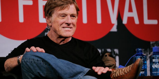 Robert Redford, founder and president of the Sundance Institute, looks on from the stage during the opening news conference of the 2014 Sundance Film Festival on Thursday, Jan. 16, 2014, in Park City, Utah.