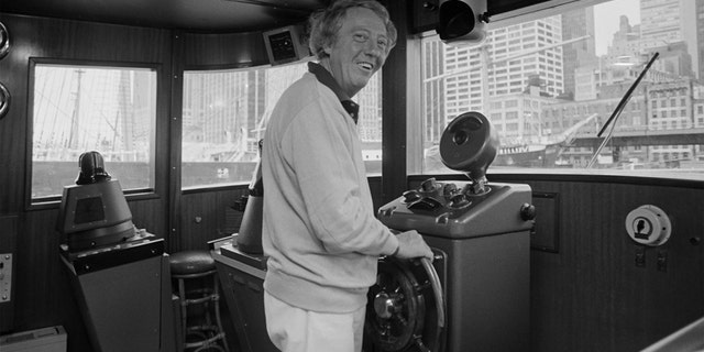A Sept. 30, 1979 photo from files of pop impresario Robert Stigwood aboard his yacht Sarina as he readies to sail out of the South Street Seaport in lower Manhattan.