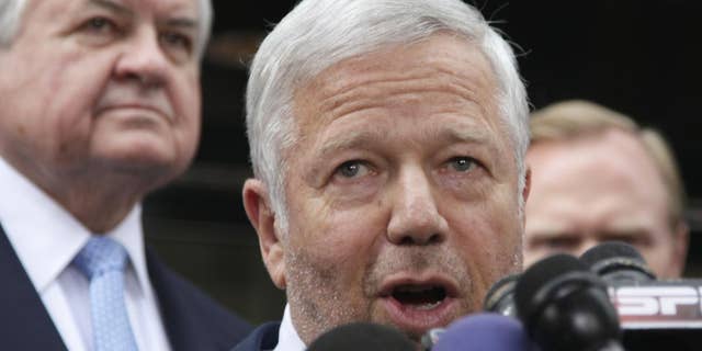 New England Patriots owner Robert Kraft, center, speaks during a news conference at the NFL Players Association in Washington, Monday, July 25, 2011, after the NFL Players Association executive board and 32 team reps voted unanimously Monday to approve the terms of a deal with owners to the end the 4½-month lockout. (AP Photo/Carolyn Kaster)