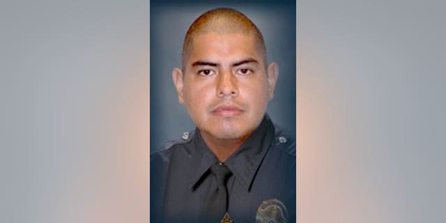 This image provided by the Los Angeles Police Department shows Officer Roberto C. Sanchez, who died Saturday May 3, 2014, at a Los Angeles hospital after the patrol car he was driving was broadsided by an SUV in the Harbor City area. The squad car was so mangled that Sanchez's partner had to call for help on his personal cellphone because the police radio wasn't working. (AP Photo/LAPD)