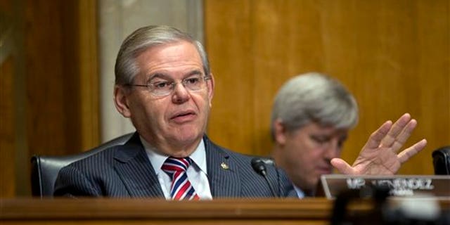 FILE - In this Jan. 9, 2014, file photo, Senate Foreign Relations Committee Chairman Sen. Robert Menendez, D-N.J., asks questions at a hearing on Capitol Hill in Washington, Thursday, Jan. 9, 2014. Menendez paid a law firm $250,000 in December 2013 for legal costs related to Justice Department and Senate Ethics Committee investigations into his ties with a major campaign donor. The Democrat also has set up a legal trust to raise money as the investigations continue. (AP Photo/Pablo Martinez Monsivais, File)